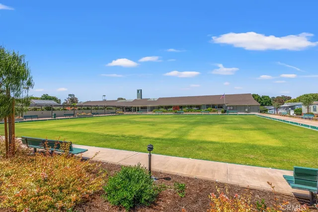 a view of a water fountain and a big yard