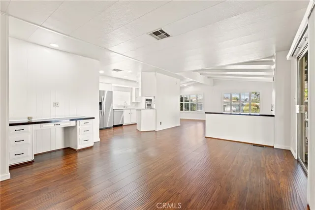 a view of a kitchen with a white cabinet and a stove top oven