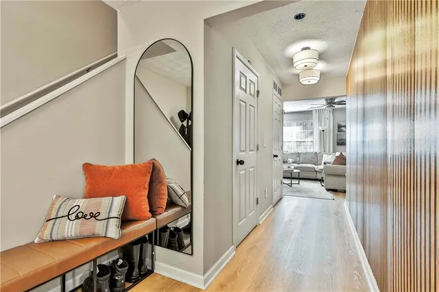 a en suite bathroom with a granite countertop sink and a mirror
