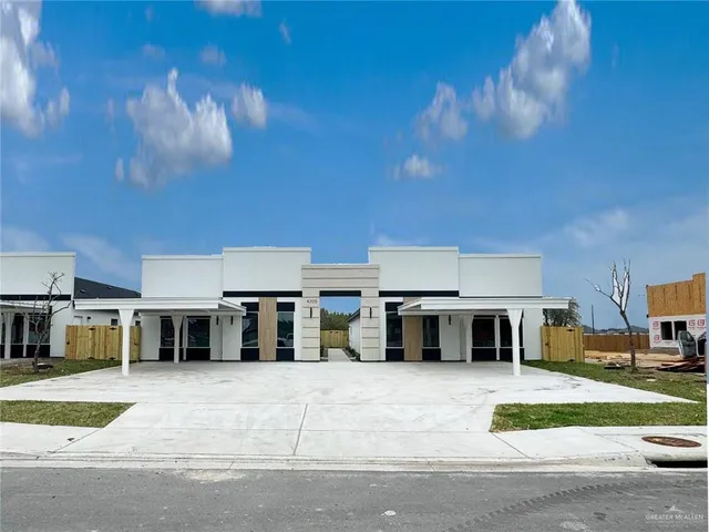 a view of a white house with a large windows