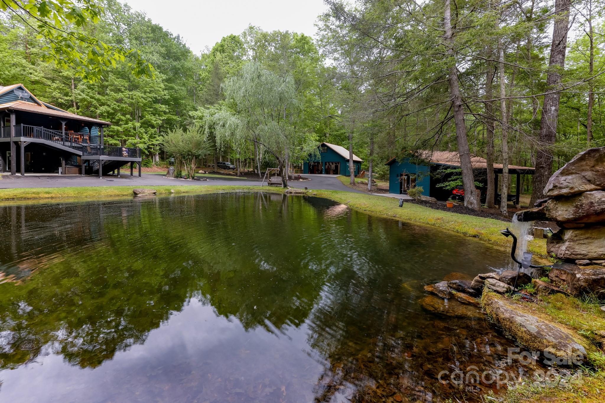 997 Proctor Road Lake Lure, NC 28746 - Photo 1 of 43 a view of swimming pool with lawn chairs and plants