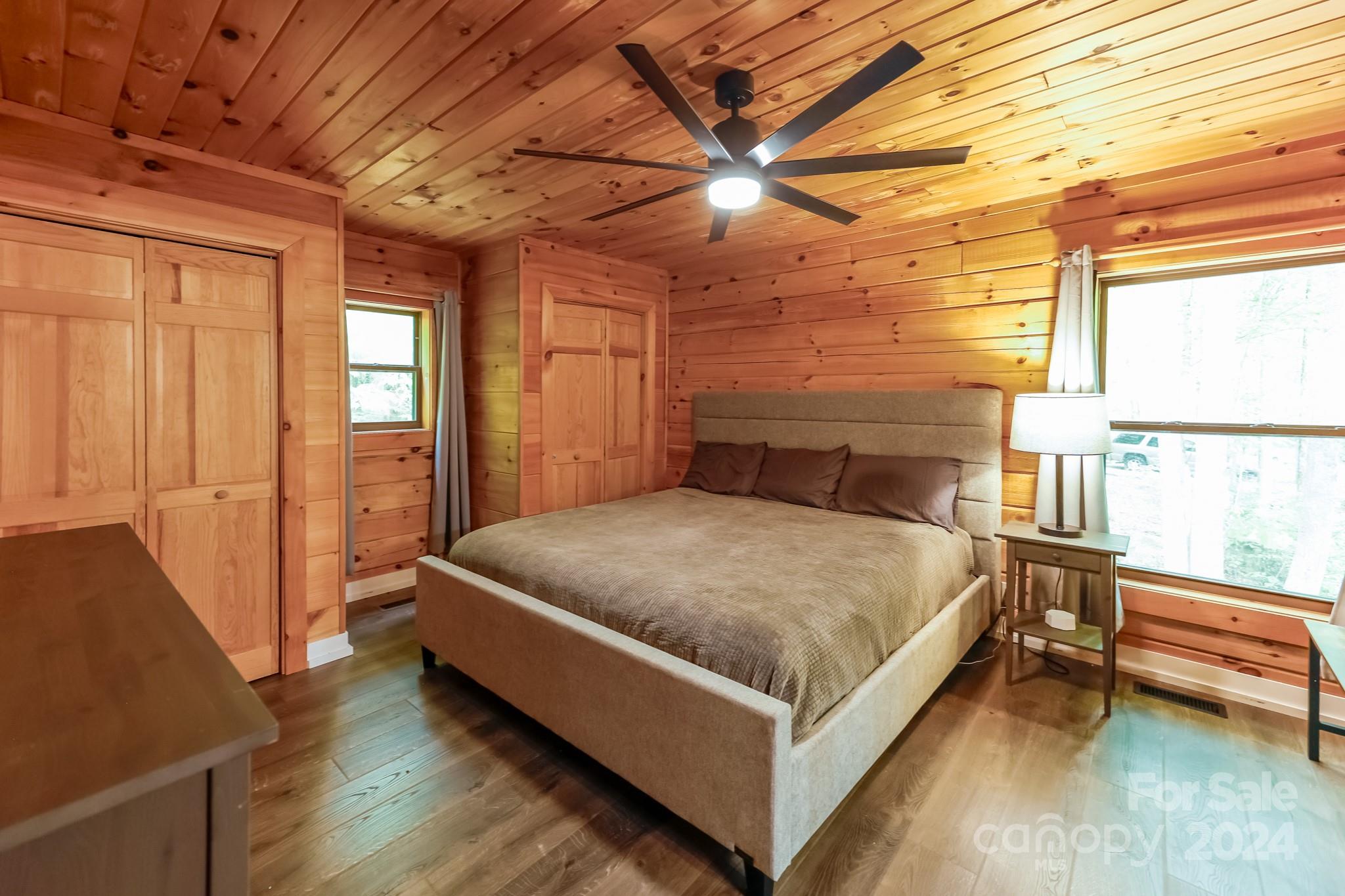 997 Proctor Road Lake Lure, NC 28746 - Photo 12 of 43 a bed sitting in a room next to a window