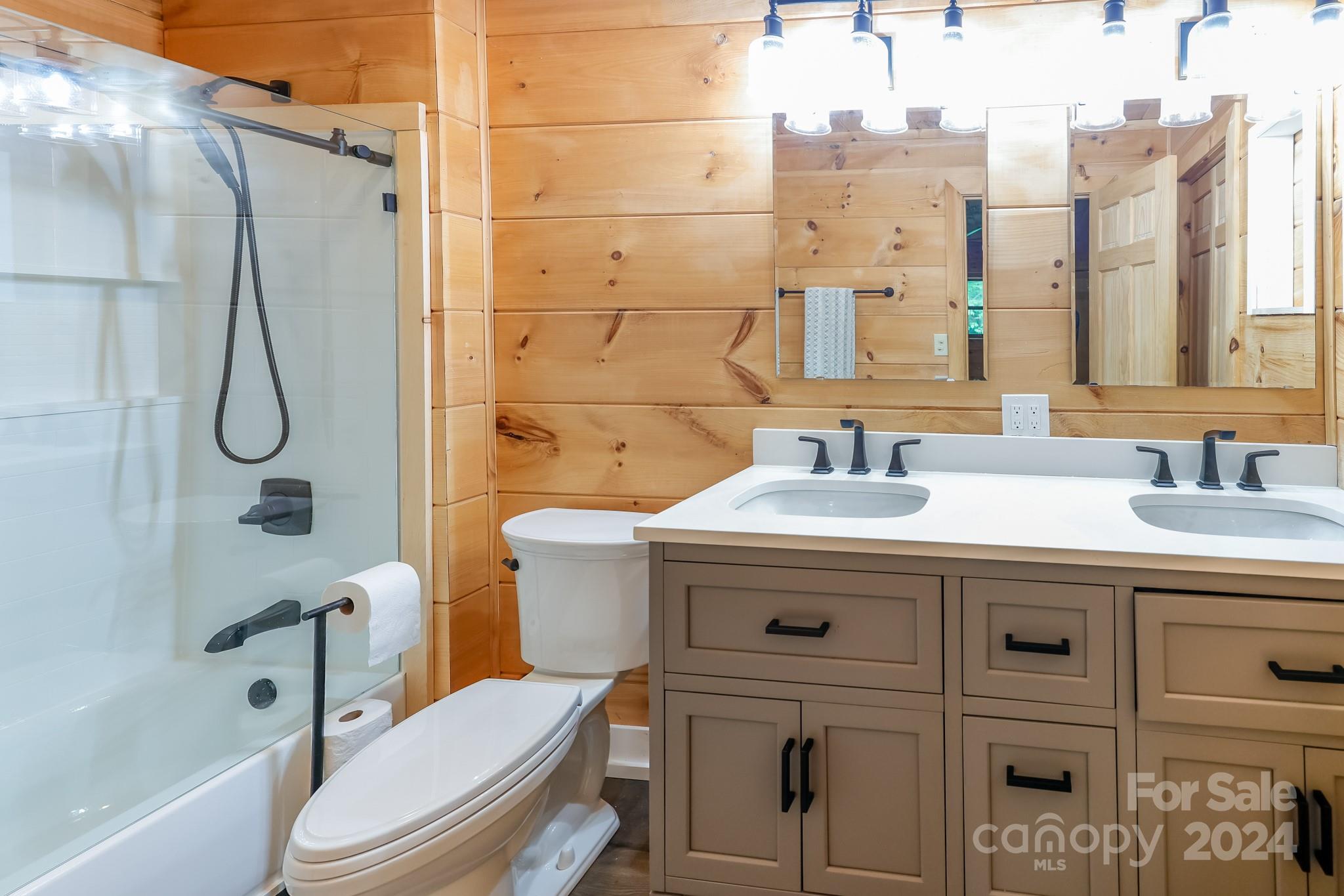 997 Proctor Road Lake Lure, NC 28746 - Photo 13 of 43 a bathroom with a sink toilet vanity and shower