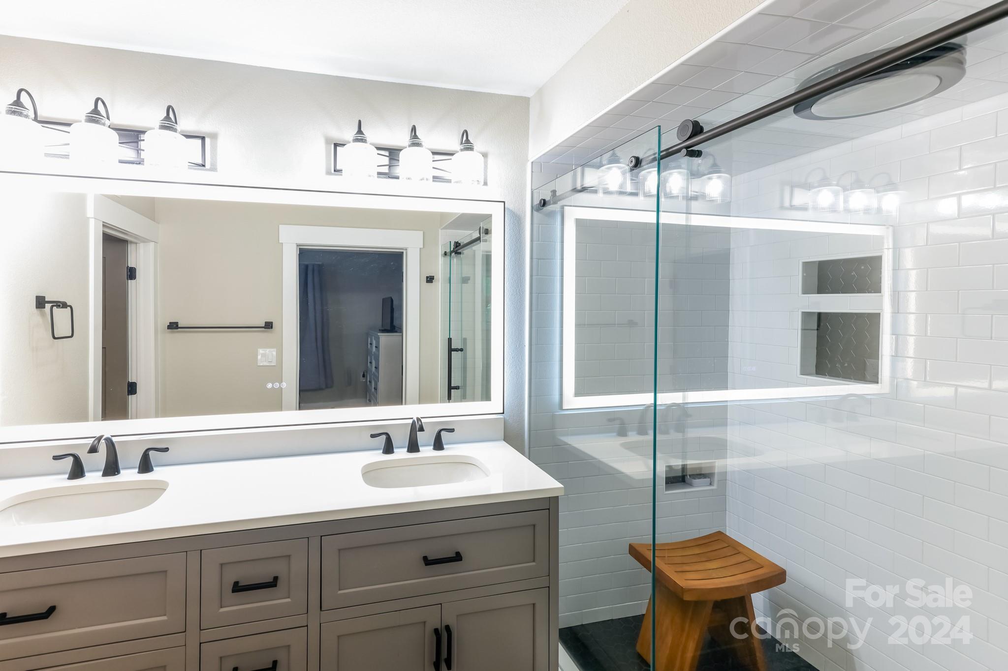 997 Proctor Road Lake Lure, NC 28746 - Photo 18 of 43 a bathroom with a sink double vanity and a toilet