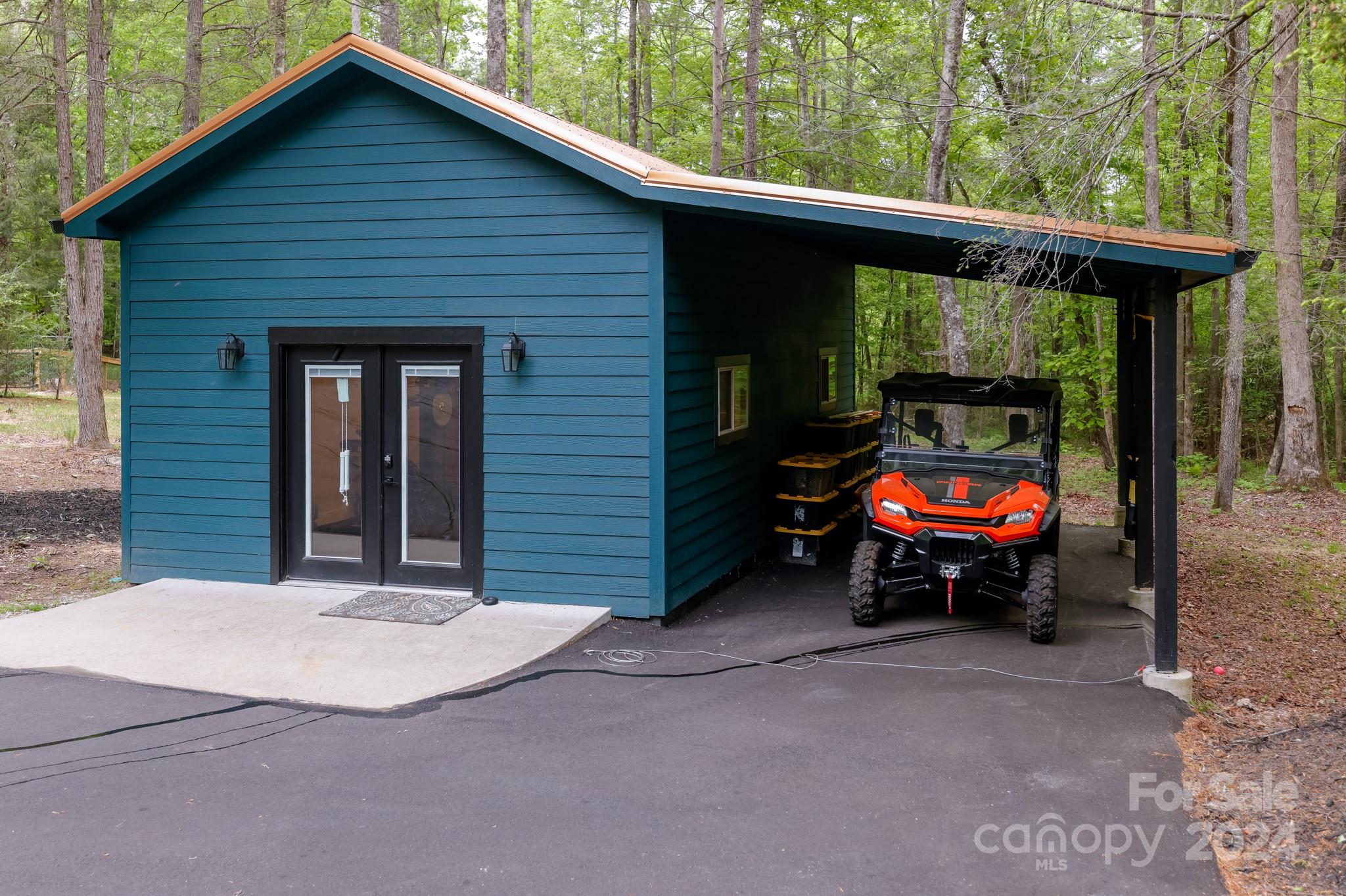 997 Proctor Road Lake Lure, NC 28746 - Photo 22 of 43 a view of a small car is parked in front of a house