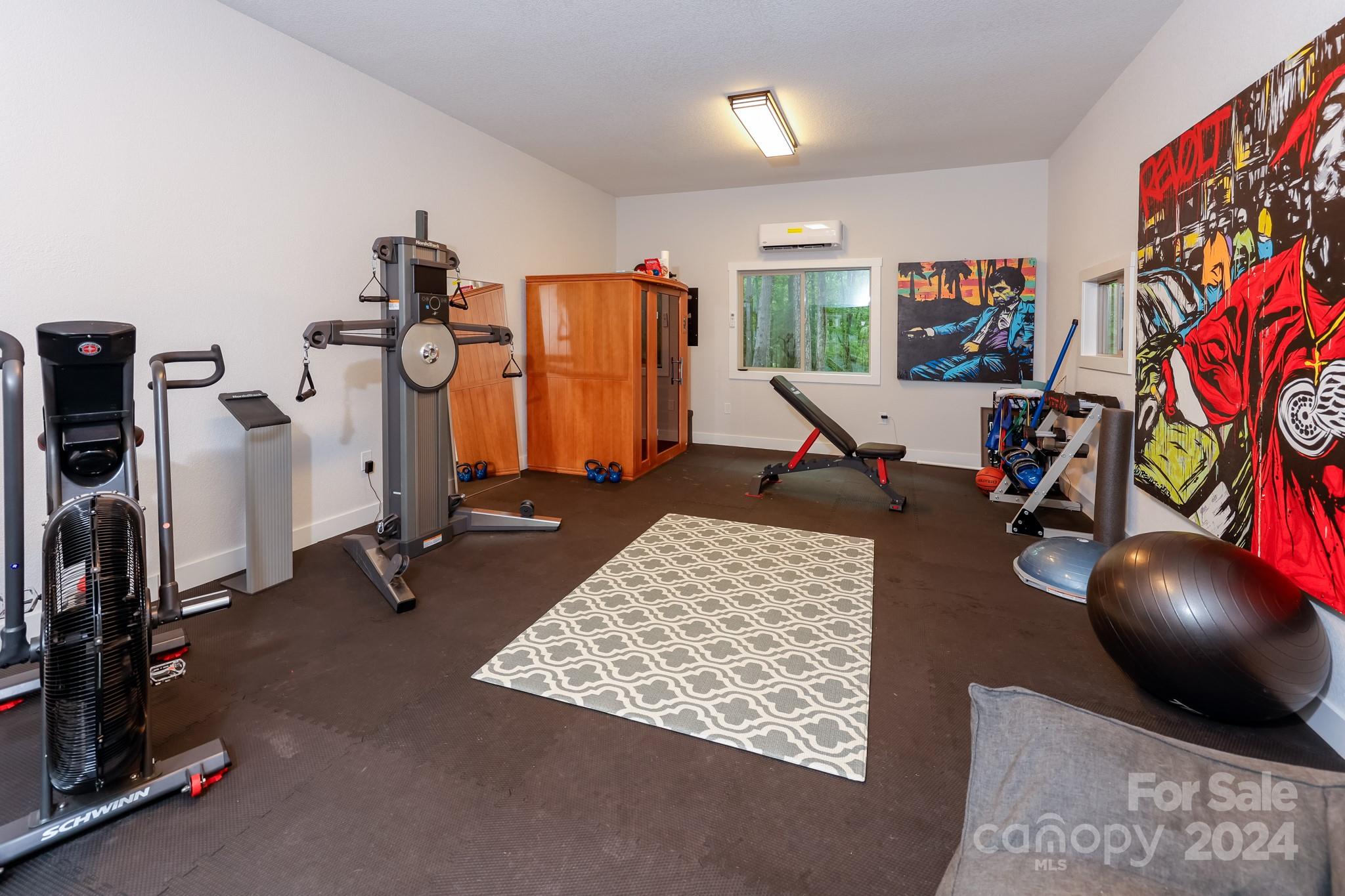 997 Proctor Road Lake Lure, NC 28746 - Photo 23 of 43 a living room with furniture and a flat screen tv