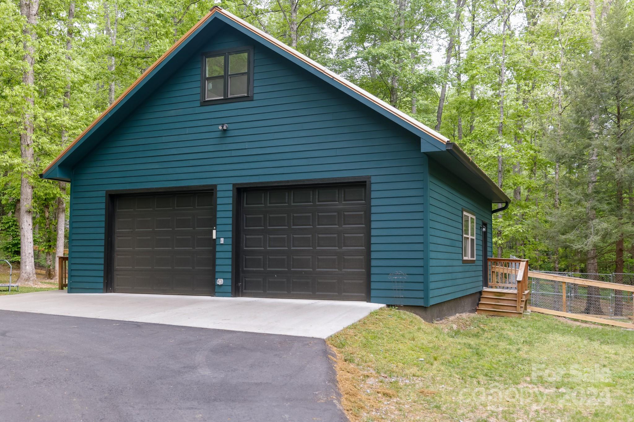 997 Proctor Road Lake Lure, NC 28746 - Photo 25 of 43 a view of a house with a garage