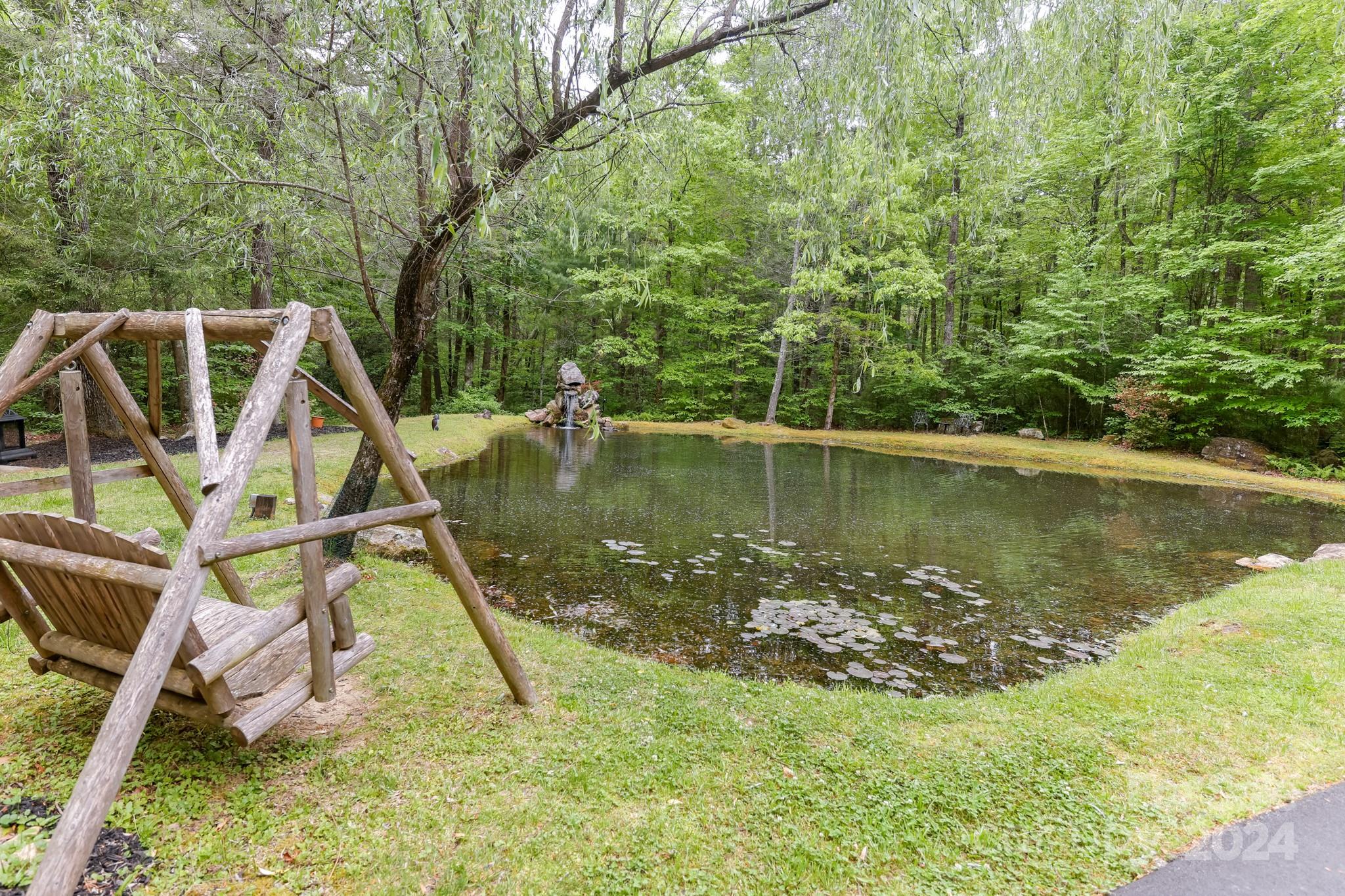997 Proctor Road Lake Lure, NC 28746 - Photo 28 of 43 a view of a lake with a wooden deck and a lake view