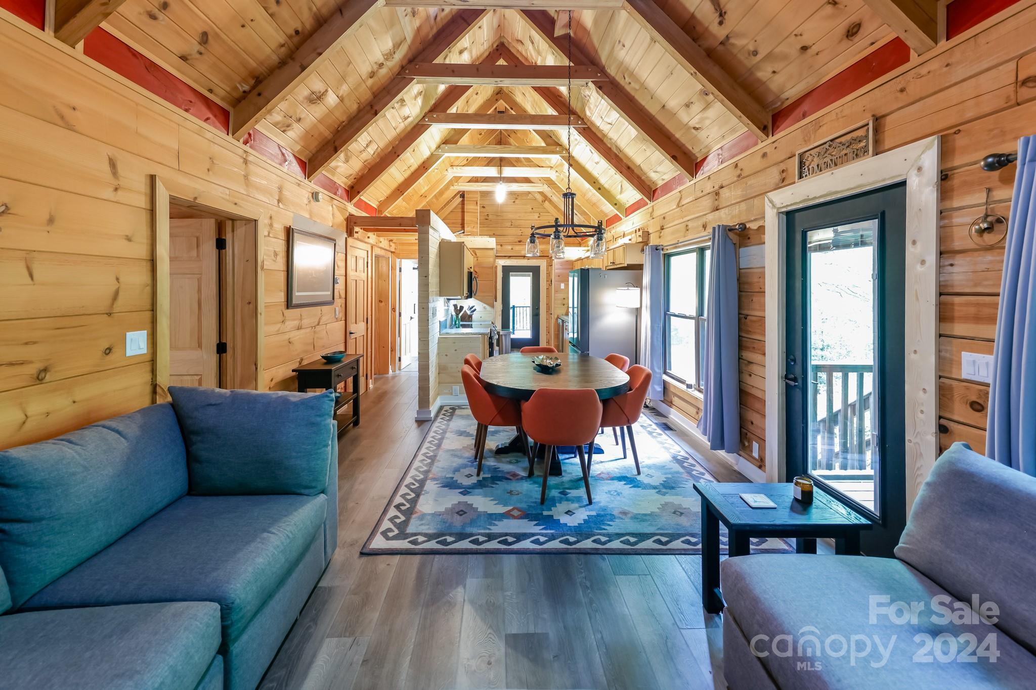 997 Proctor Road Lake Lure, NC 28746 - Photo 10 of 43 a living room with furniture and a large window