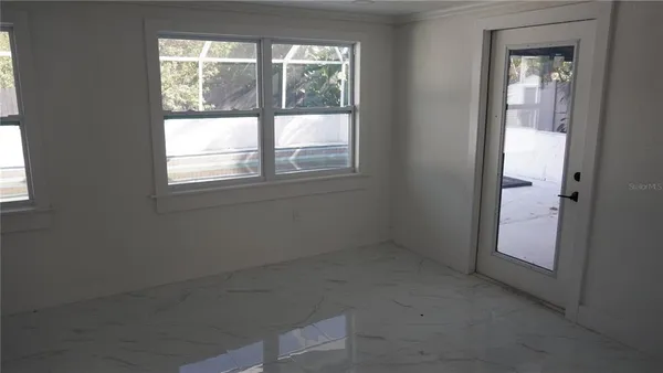 an empty room that has a window