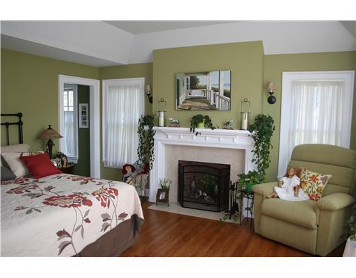27 Laforge Road Darien, CT 06820 - Photo 14 of 20 a bedroom with a bed and a fireplace