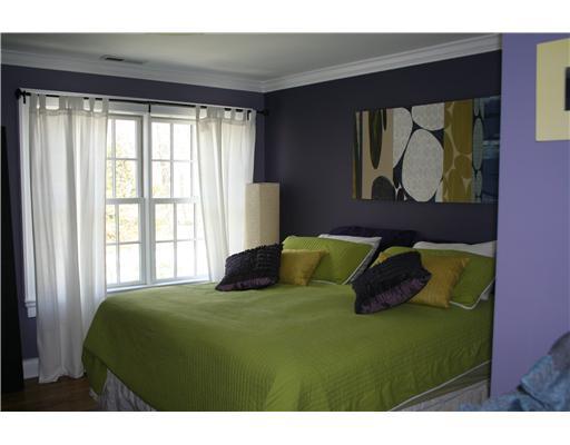 27 Laforge Road Darien, CT 06820 - Photo 16 of 20 a bedroom with a bed and painting on the wall