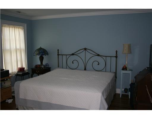 27 Laforge Road Darien, CT 06820 - Photo 17 of 20 a bedroom with a bed and two windows