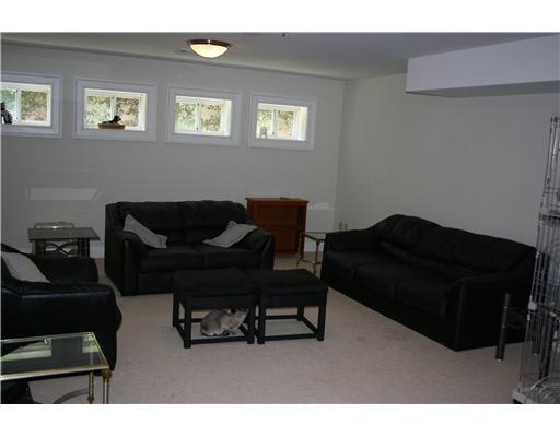 27 Laforge Road Darien, CT 06820 - Photo 19 of 20 a living room with furniture and a chair