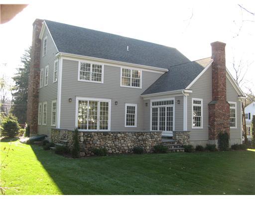 27 Laforge Road Darien, CT 06820 - Photo 2 of 20 a front view of a house with a garden