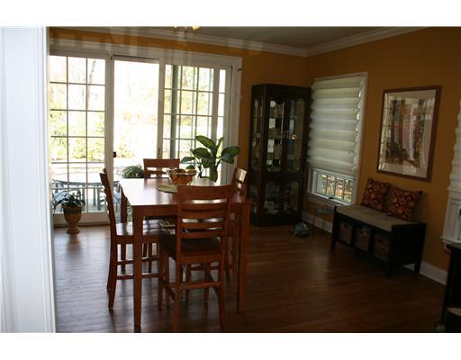 27 Laforge Road Darien, CT 06820 - Photo 6 of 20 a dining room with wooden floor and a floor to ceiling window