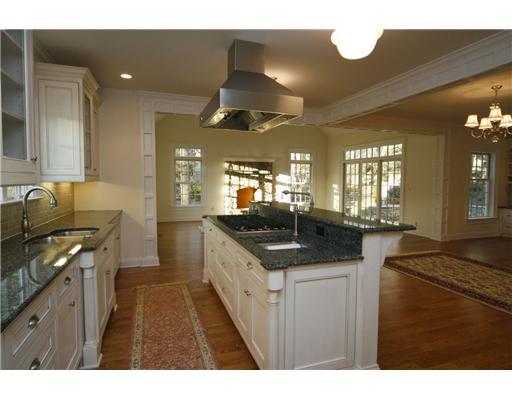 27 Laforge Road Darien, CT 06820 - Photo 10 of 20 a kitchen with stainless steel appliances granite countertop a sink a stove and a wooden floors