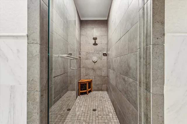 a bathroom with a granite countertop sink a toilet and bathtub