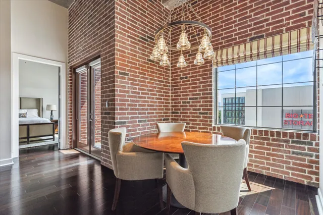 a dining room with furniture and wooden floor