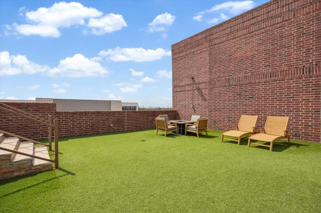 a view of a terrace with wooden benches