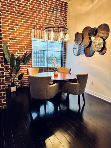 a bedroom with a bed and a flat tv screen on a table