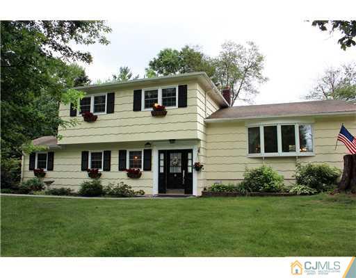 3 Devon Road Edison, NJ 08820 - Photo 1 of 17 a view of a house with a yard and potted plants