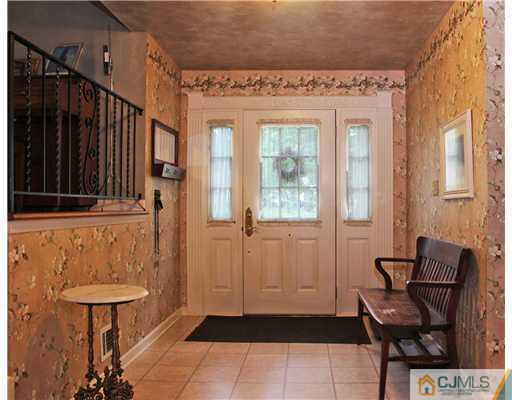 3 Devon Road Edison, NJ 08820 - Photo 2 of 17 a view of a entryway with furniture and front door
