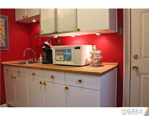 3 Devon Road Edison, NJ 08820 - Photo 11 of 17 a kitchen with a sink cabinets and wooden floor