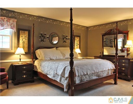 3 Devon Road Edison, NJ 08820 - Photo 12 of 17 a bedroom with a bed lamp closet and window