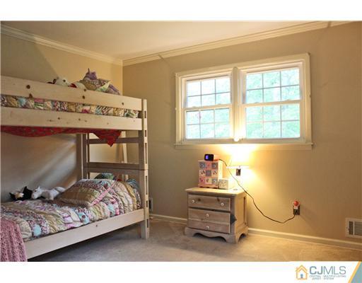3 Devon Road Edison, NJ 08820 - Photo 14 of 17 a bedroom with a bed and a window