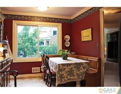 3 Devon Road Edison, NJ 08820 - Photo 8 of 17 a view of a dining room with furniture window and outside view