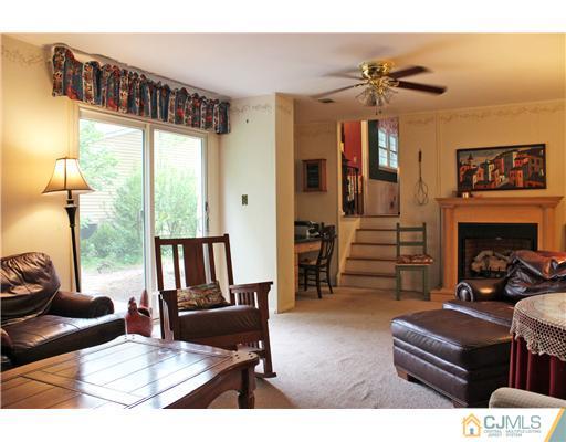 3 Devon Road Edison, NJ 08820 - Photo 10 of 17 a living room with furniture and a fireplace