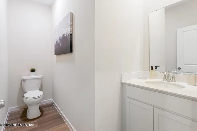 a bathroom with a toilet and a sink