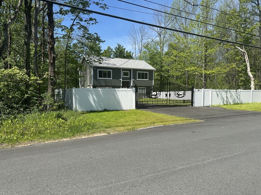 102 Wells Road Becket, MA 01223 - Photo 5 of 40 a view of a house with a yard