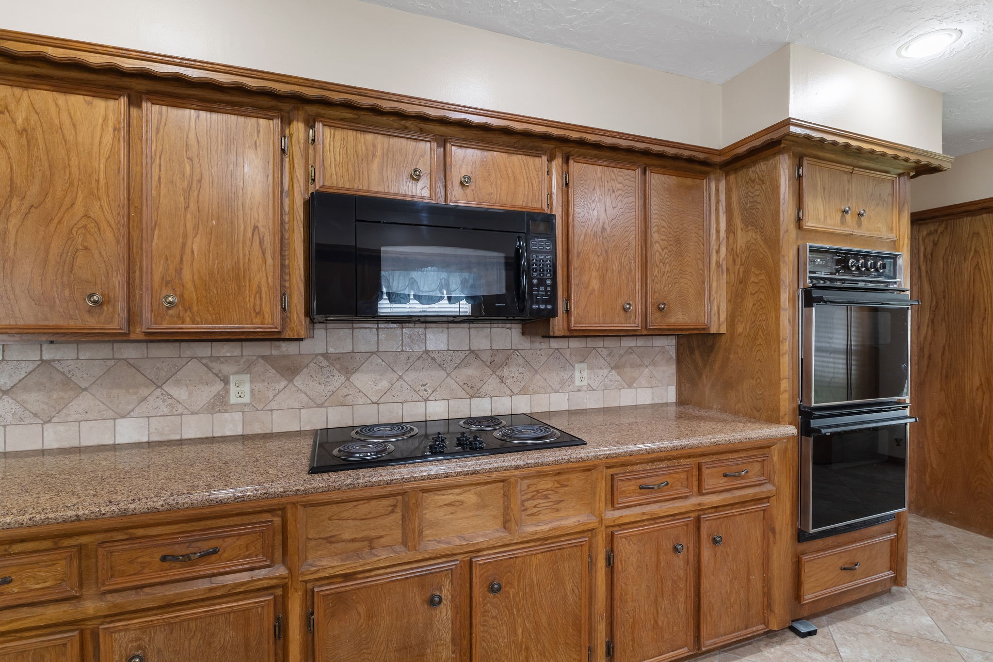 460 Dover Lane Spring, TX 77373 - Photo 11 of 47 a kitchen with granite countertop a sink cabinets and stainless steel appliances