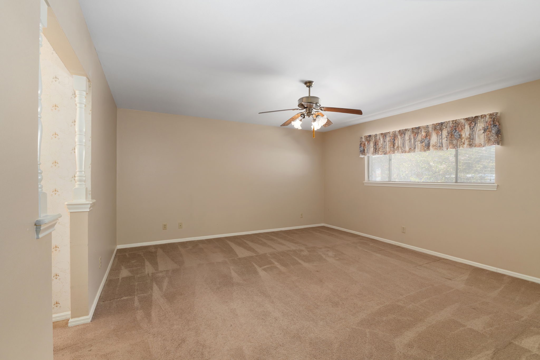 460 Dover Lane Spring, TX 77373 - Photo 20 of 47 a view of an empty room with chandelier fan and fire place