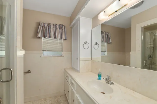 a bathroom with a sink and a mirror