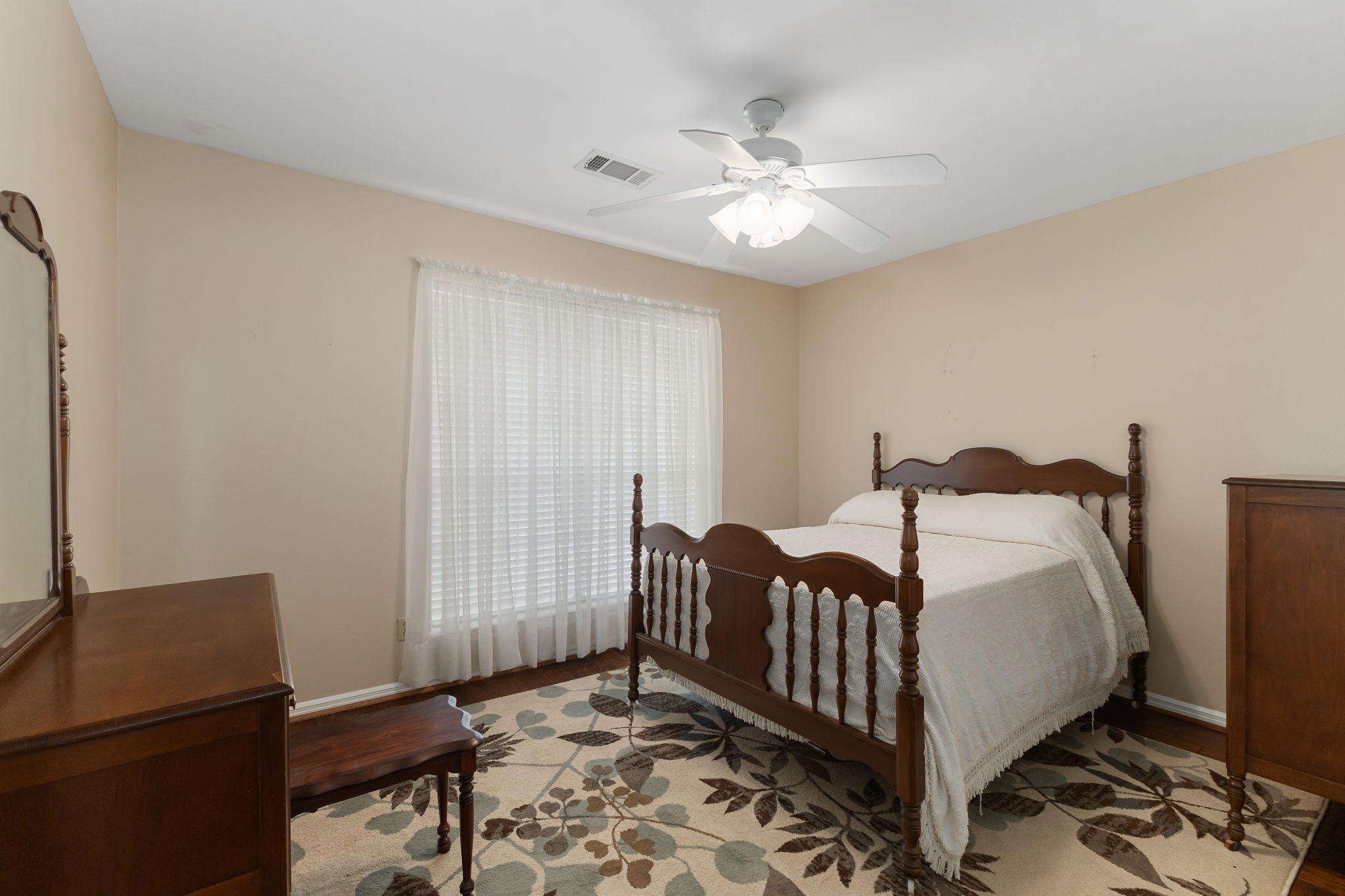 460 Dover Lane Spring, TX 77373 - Photo 25 of 47 a bedroom with a bed and a chandelier