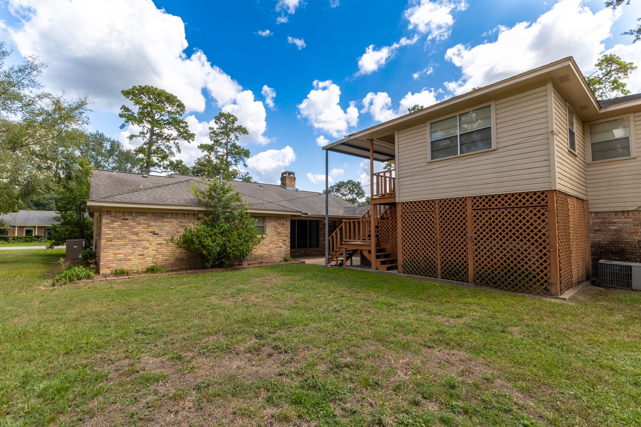 460 Dover Lane Spring, TX 77373 - Photo 35 of 47 a view of a house with a yard and a garage