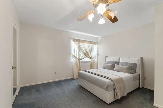 a bathroom with a sink a mirror and a shower