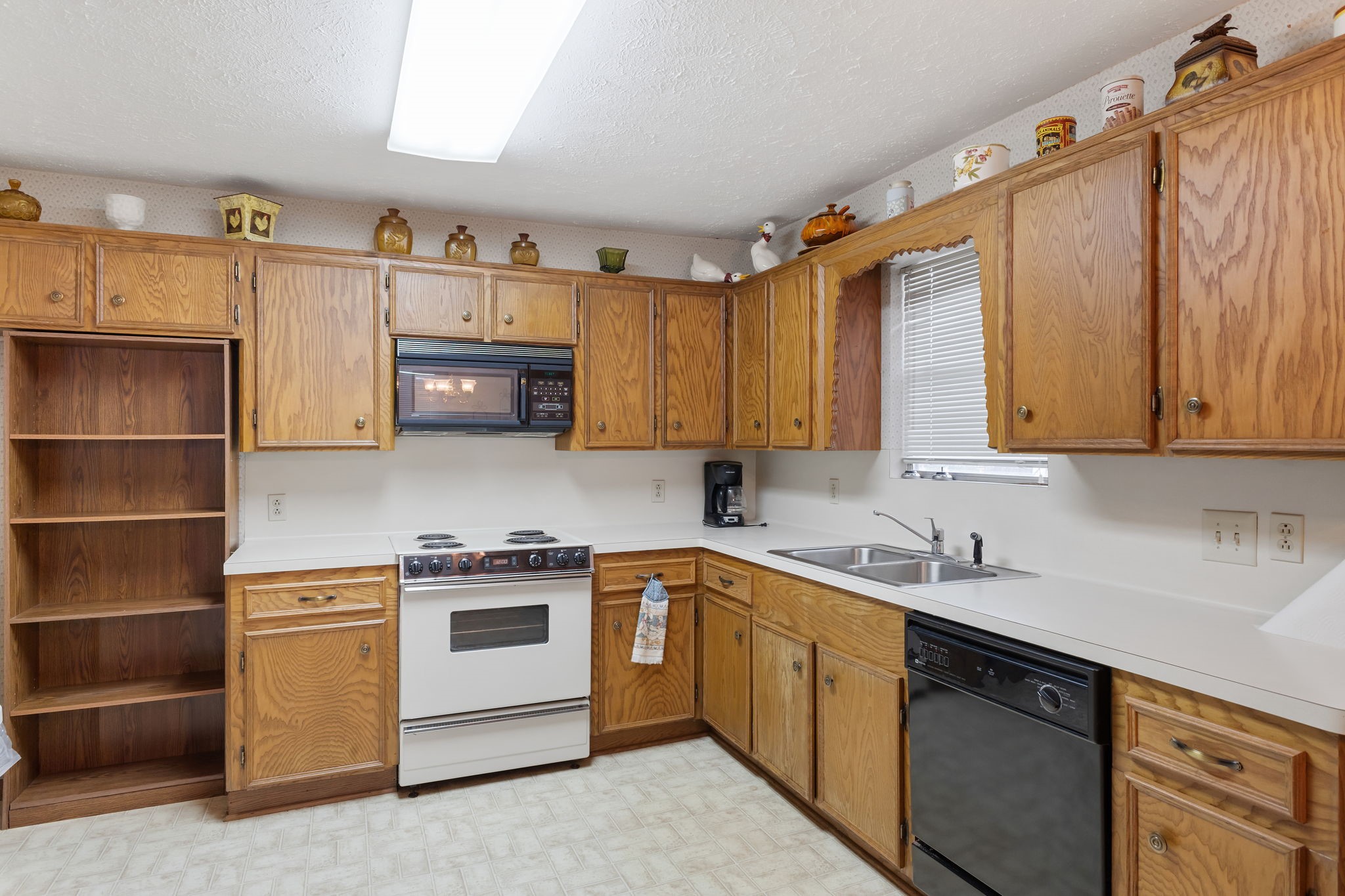 460 Dover Lane Spring, TX 77373 - Photo 40 of 47 a kitchen with a sink cabinets and appliances