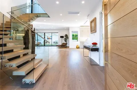 a lobby with furniture and wooden floor