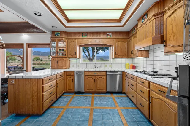 a bed sitting in a bedroom next to a balcony with a fireplace