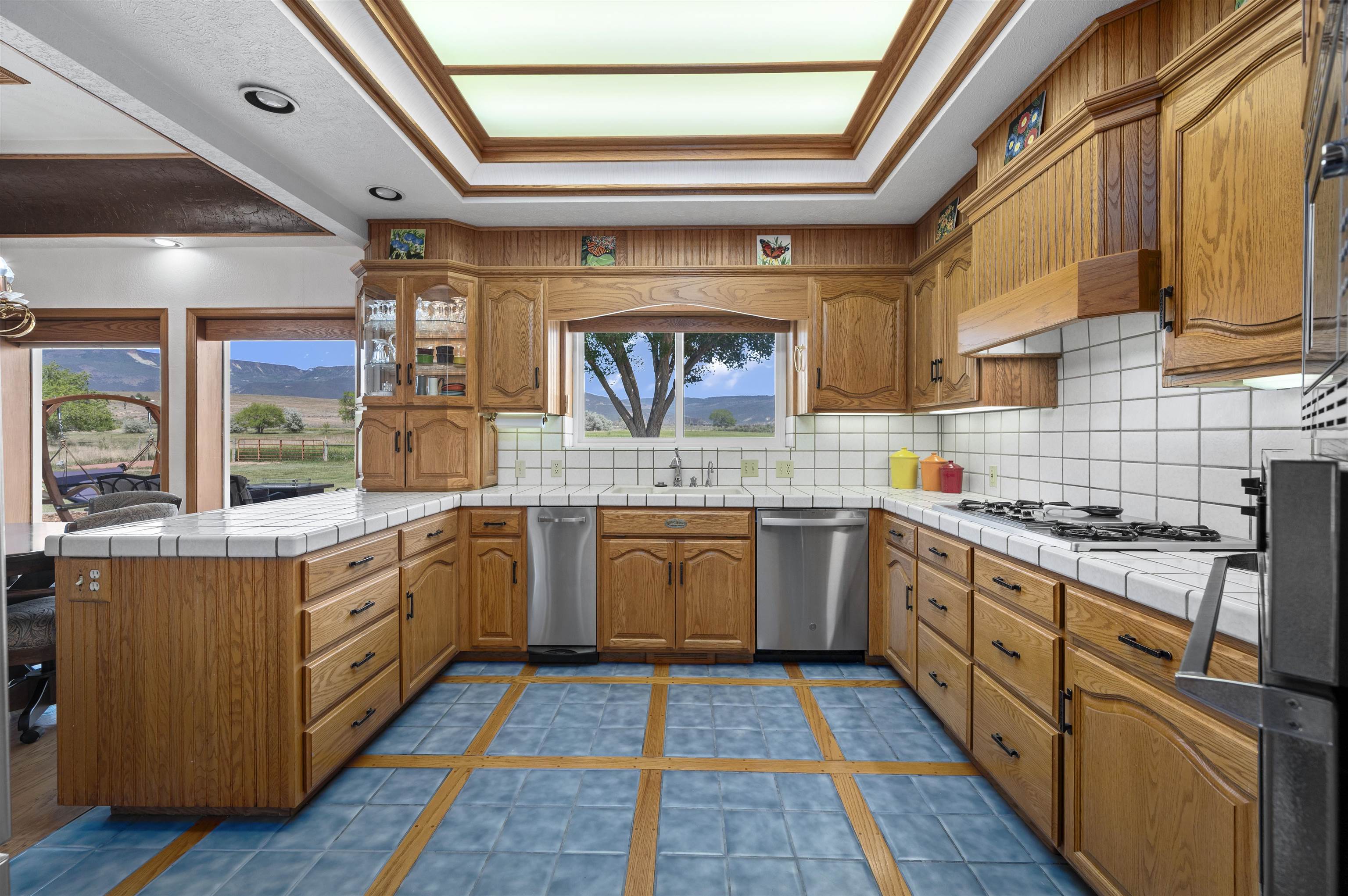 6800 Reeder Mesa Road Whitewater, CO 81527 - Photo 11 of 38 a large kitchen with stainless steel appliances granite countertop a stove and a sink
