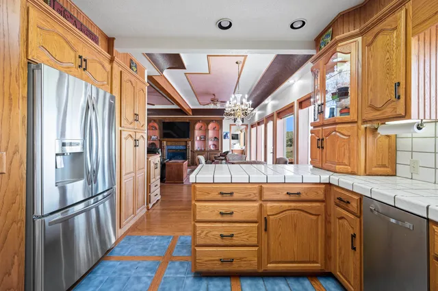 a bedroom with a bed next to a window