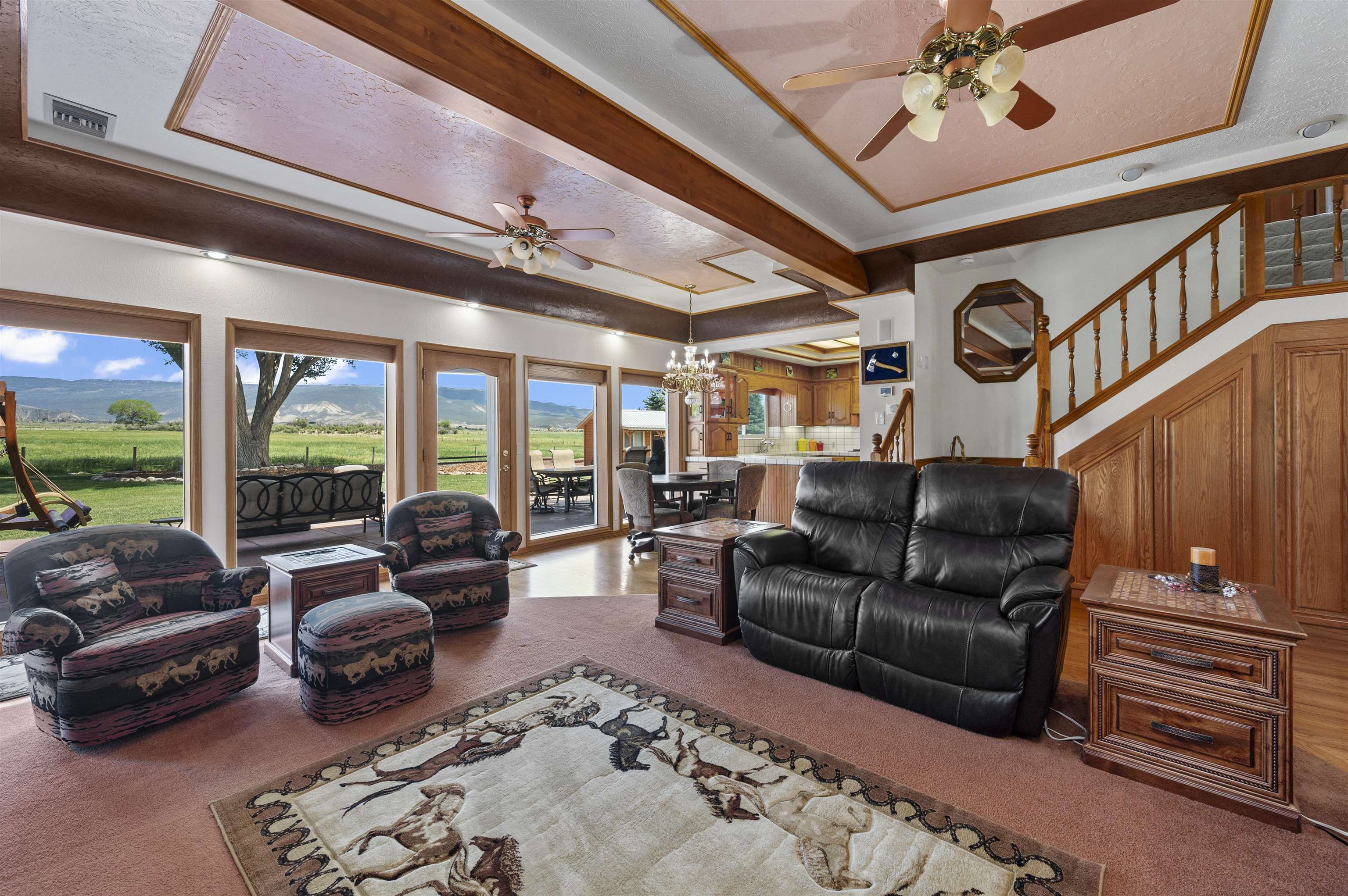 6800 Reeder Mesa Road Whitewater, CO 81527 - Photo 13 of 38 a living room with furniture ceiling fan and a rug