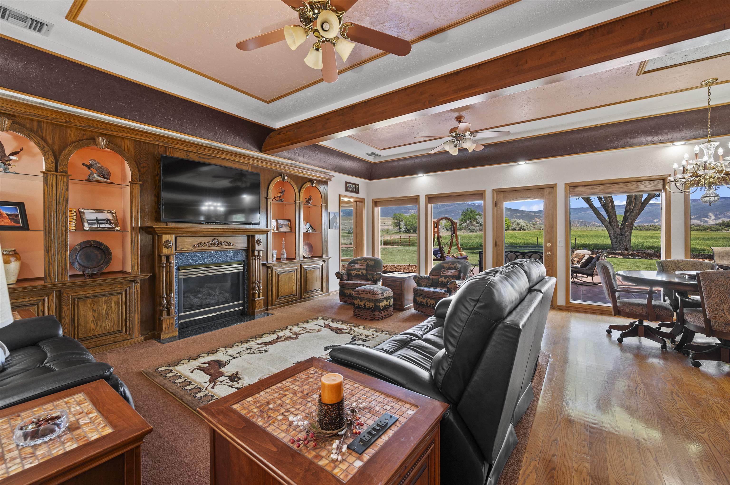 6800 Reeder Mesa Road Whitewater, CO 81527 - Photo 14 of 38 a living room with fireplace furniture and a floor to ceiling window