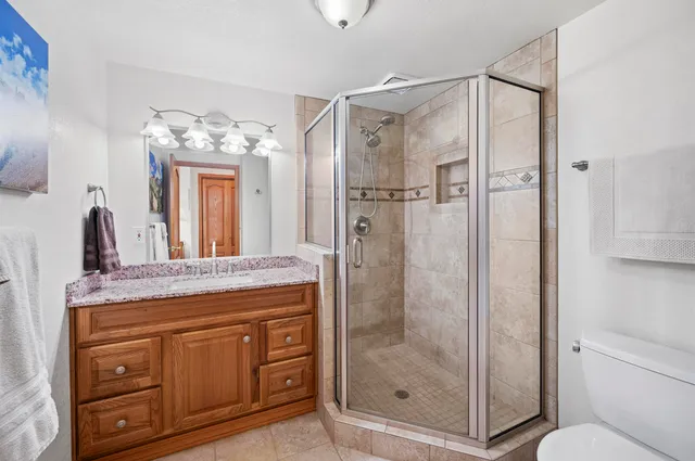 a bedroom with a bed and a closet