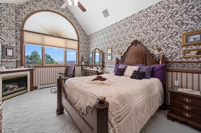 a view of a house with a yard and potted plants