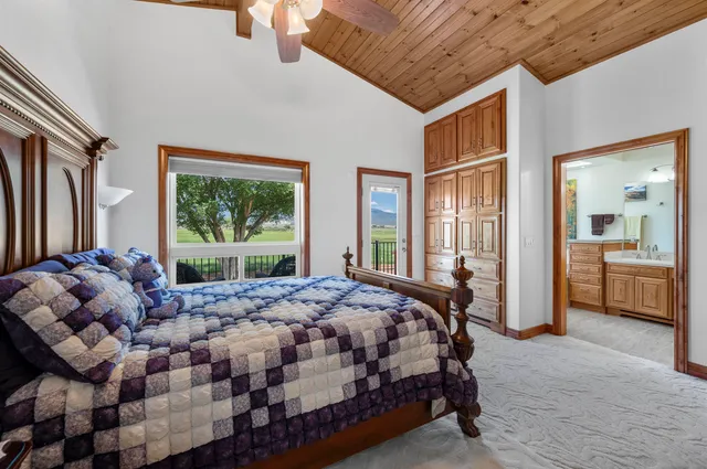 a view of a house with swimming pool and sitting area